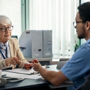 Engineer interviewing an older person. Image created with Adobe Firefly AI