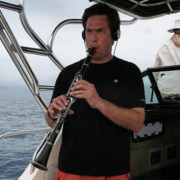 David Rothenberg playing music on a boat