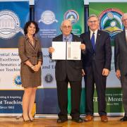 Howard Kimmel, NJIT professor emeritus, accepts his PAESMEM award.