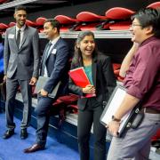 students smiling at a campus career fair 