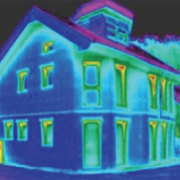 Infrared (IR) image of well insulated house showing minor leakage of heat near the tops of windows. 